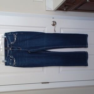 Earl brand Size 10 jeans with white stitching and silver studs.
